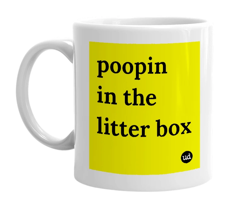White mug with 'poopin in the litter box' in bold black letters
