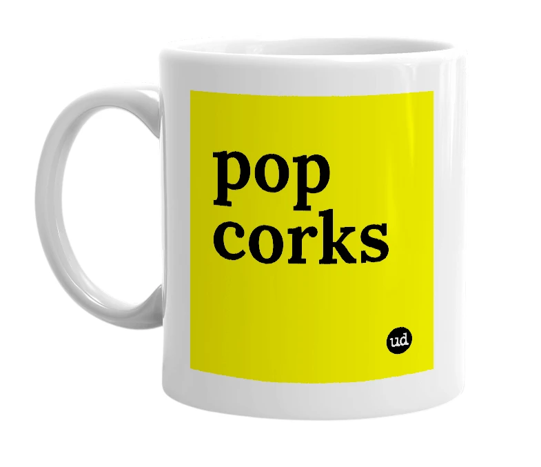 White mug with 'pop corks' in bold black letters