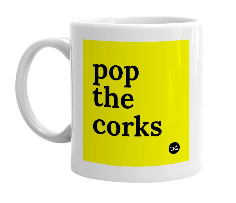 White mug with 'pop the corks' in bold black letters