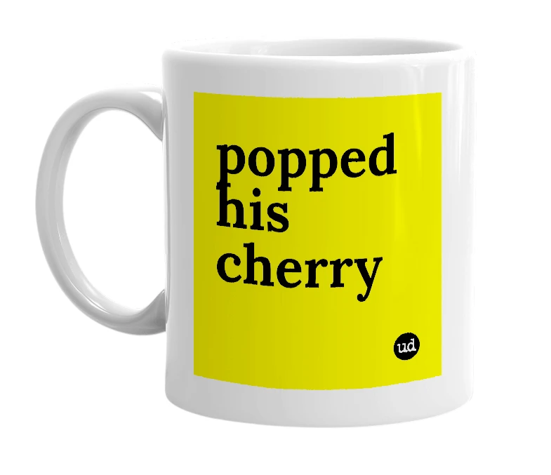 White mug with 'popped his cherry' in bold black letters