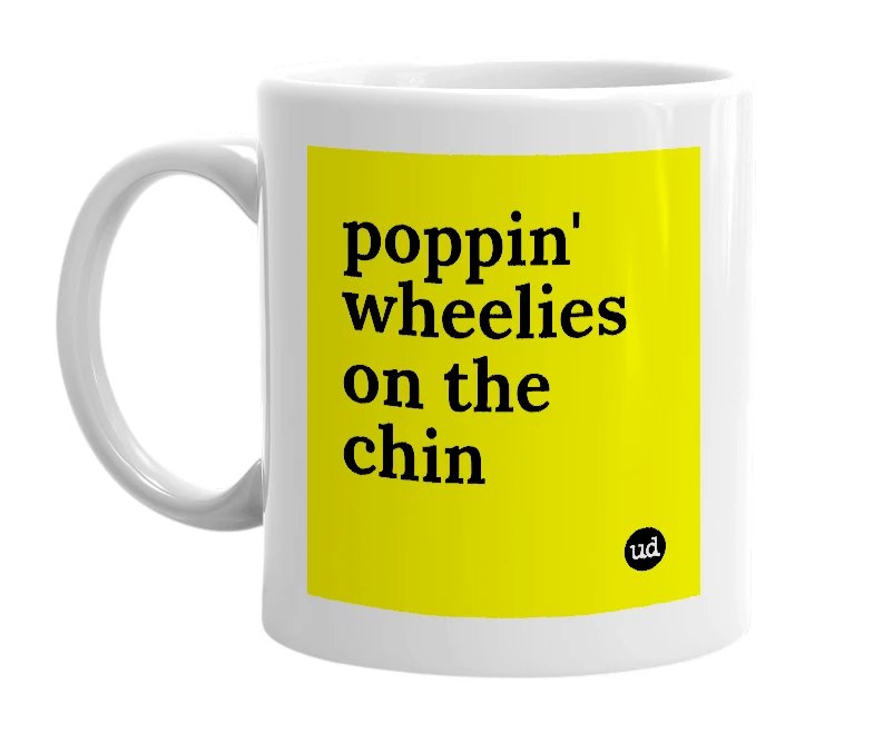 White mug with 'poppin' wheelies on the chin' in bold black letters