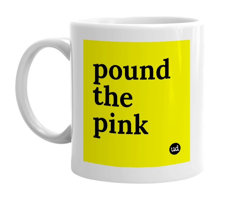 White mug with 'pound the pink' in bold black letters