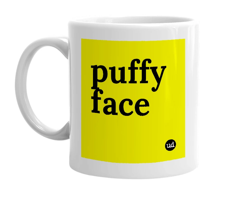 White mug with 'puffy face' in bold black letters