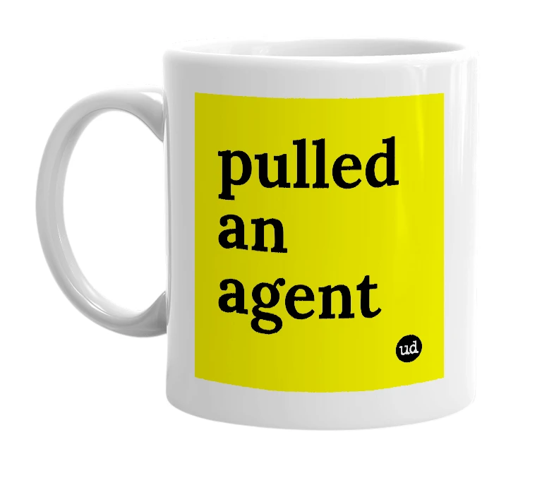White mug with 'pulled an agent' in bold black letters