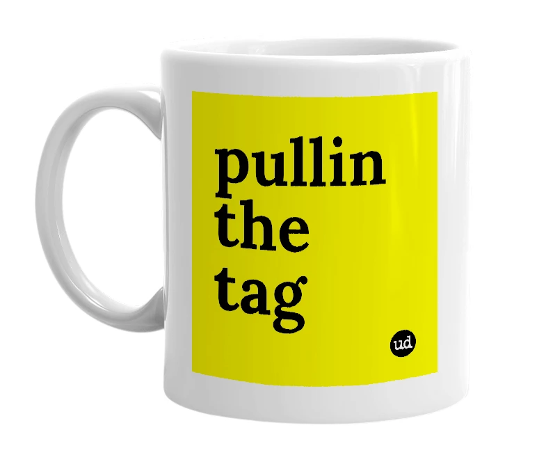 White mug with 'pullin the tag' in bold black letters