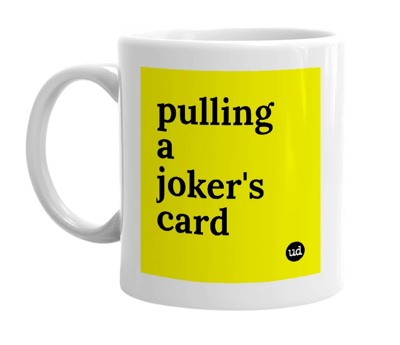White mug with 'pulling a joker's card' in bold black letters