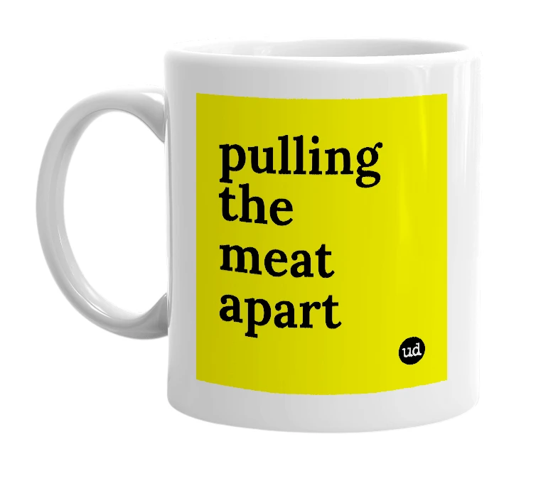 White mug with 'pulling the meat apart' in bold black letters