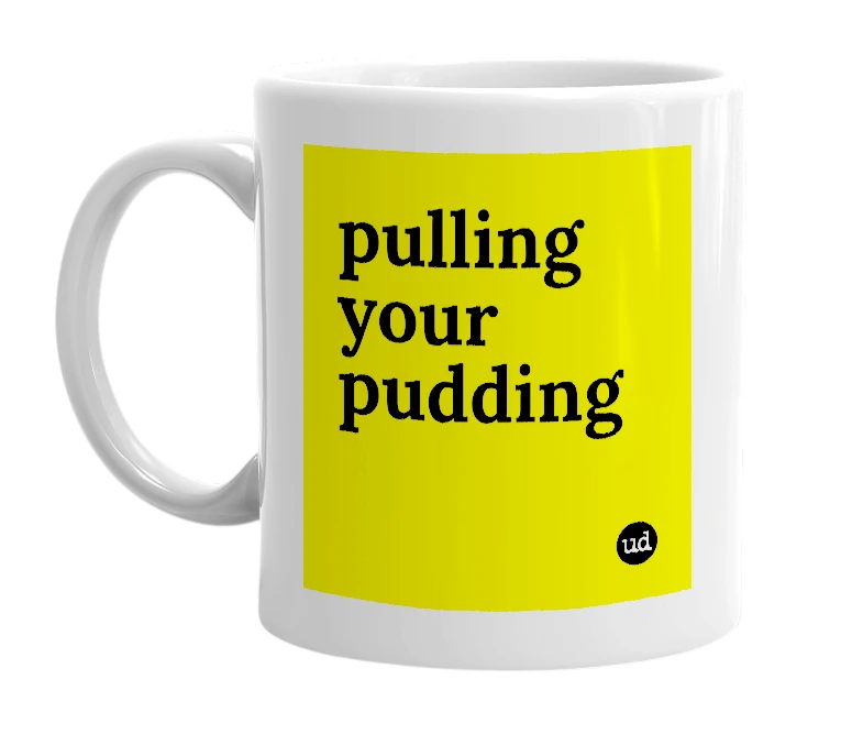 White mug with 'pulling your pudding' in bold black letters