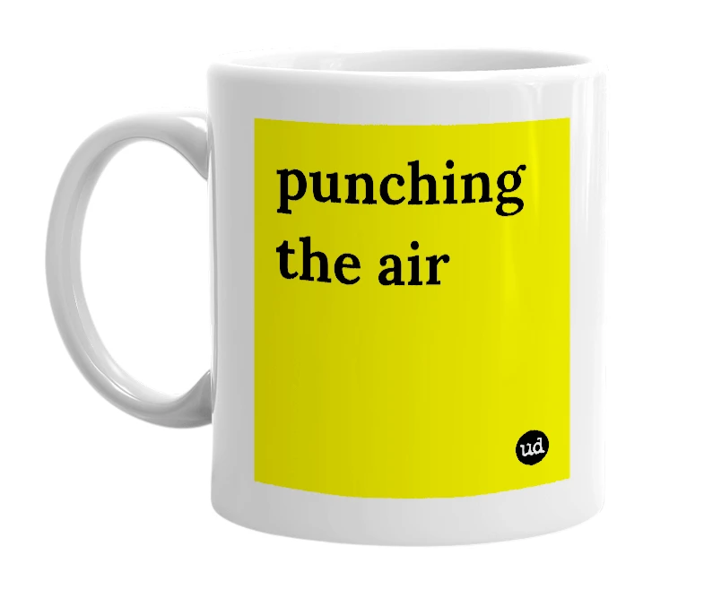 White mug with 'punching the air' in bold black letters