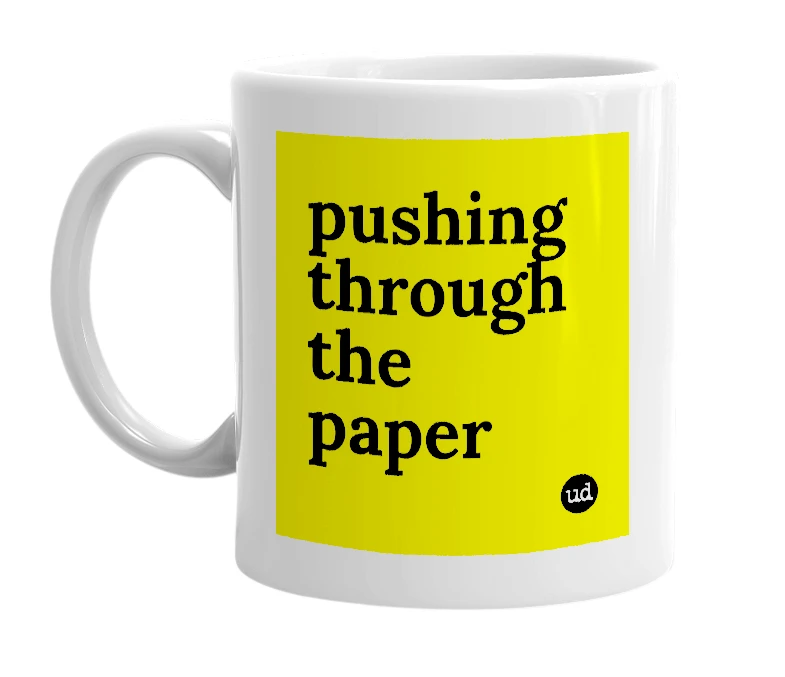 White mug with 'pushing through the paper' in bold black letters