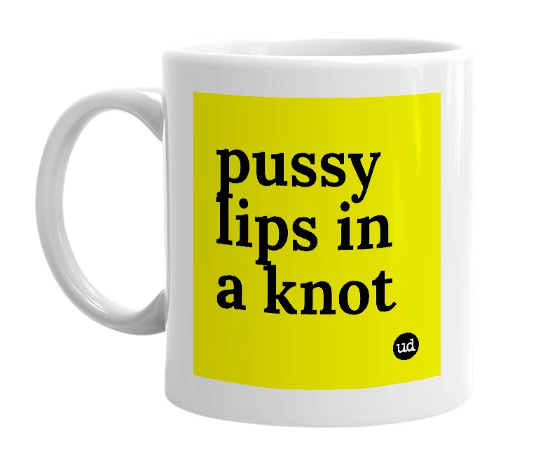 White mug with 'pussy lips in a knot' in bold black letters