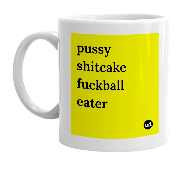 White mug with 'pussy shitcake fuckball eater' in bold black letters