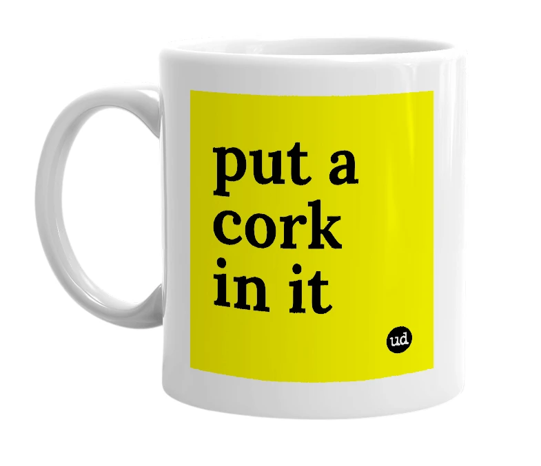 White mug with 'put a cork in it' in bold black letters