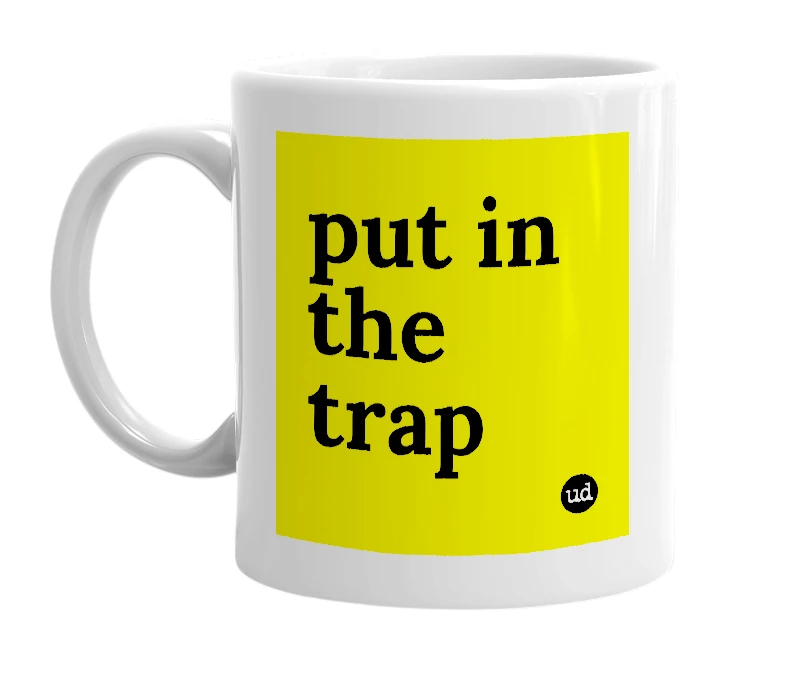 White mug with 'put in the trap' in bold black letters