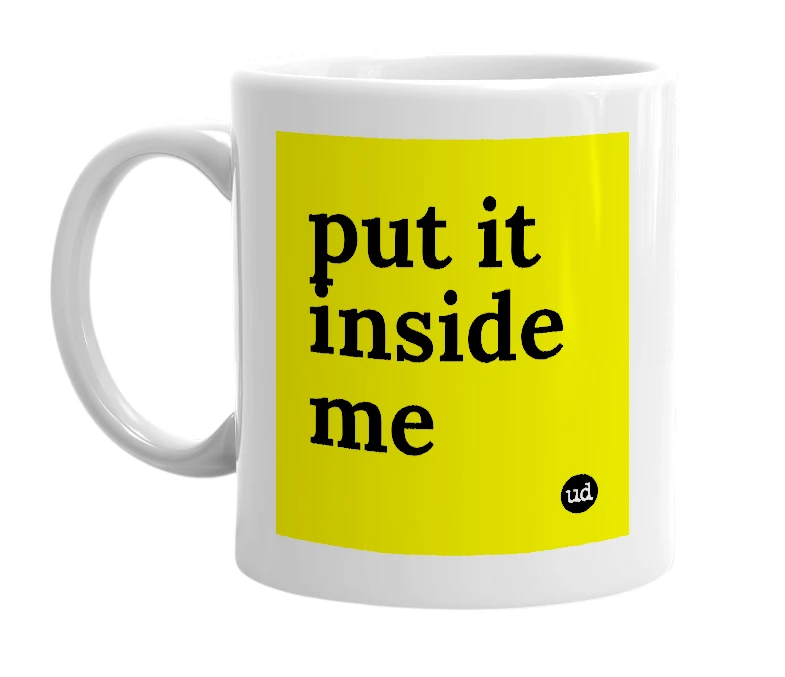 White mug with 'put it inside me' in bold black letters