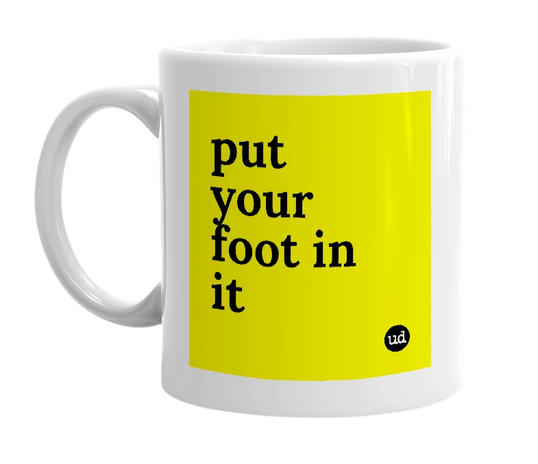 White mug with 'put your foot in it' in bold black letters