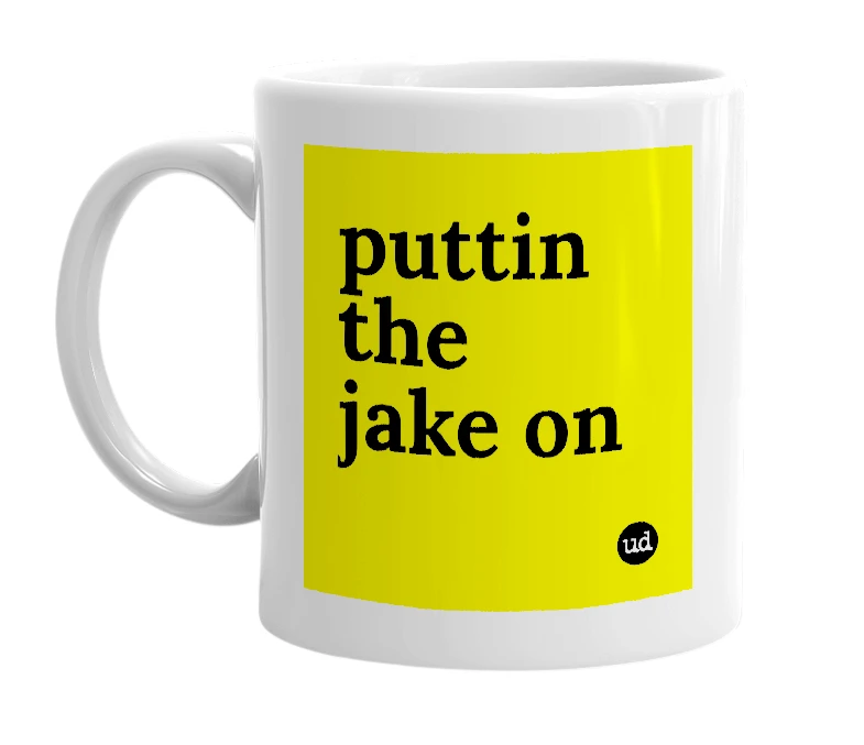 White mug with 'puttin the jake on' in bold black letters