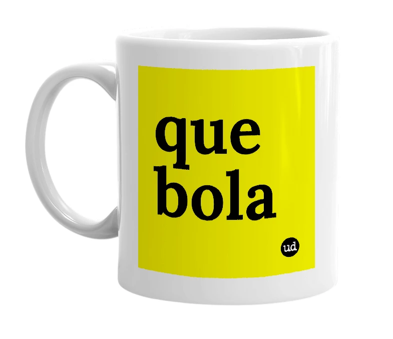 White mug with 'que bola' in bold black letters