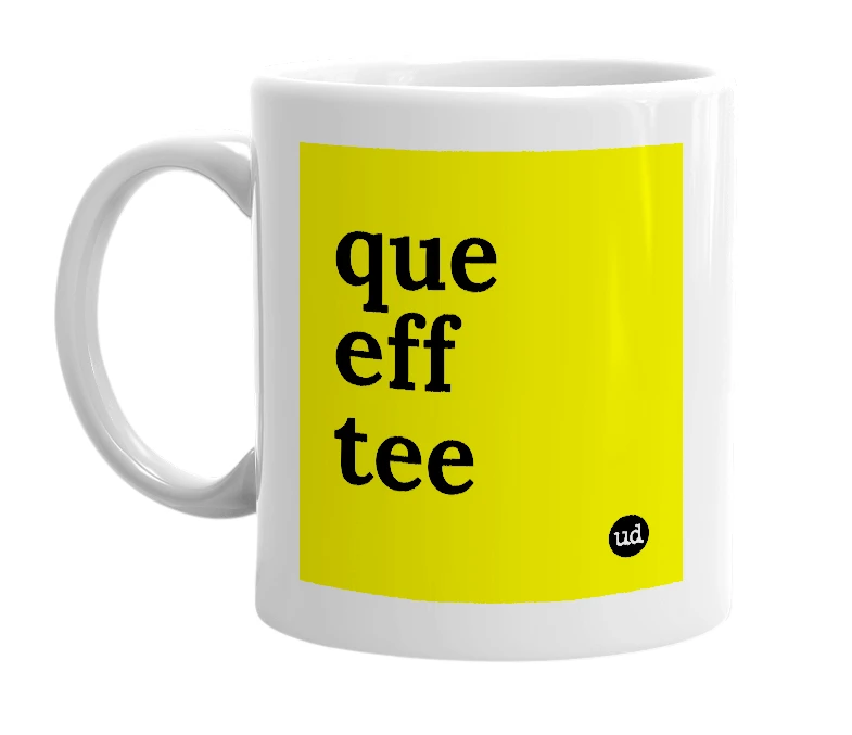 White mug with 'que eff tee' in bold black letters