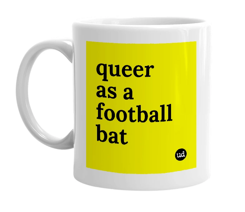 White mug with 'queer as a football bat' in bold black letters