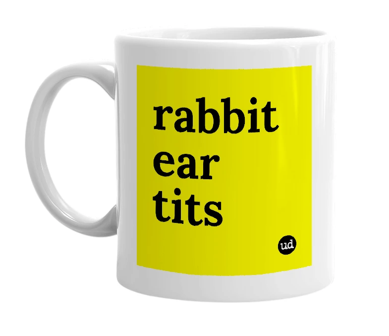 White mug with 'rabbit ear tits' in bold black letters