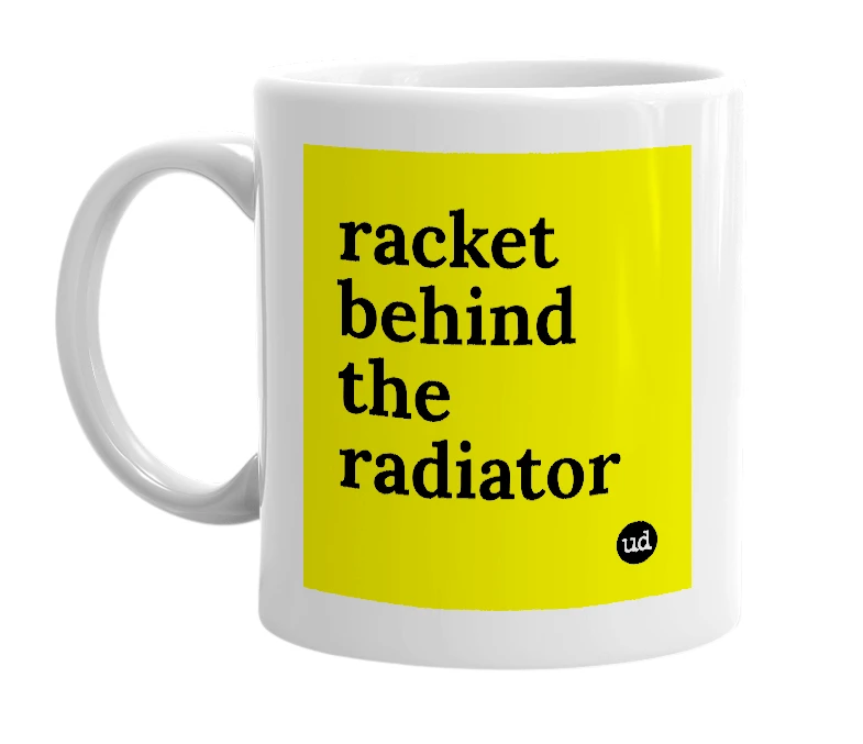White mug with 'racket behind the radiator' in bold black letters