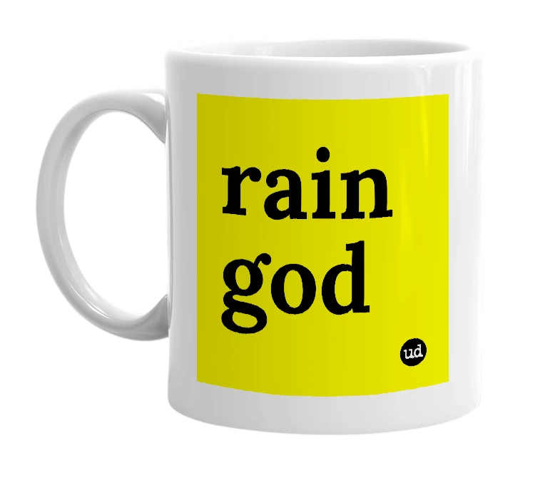 White mug with 'rain god' in bold black letters