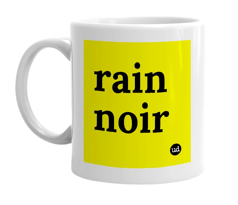 White mug with 'rain noir' in bold black letters
