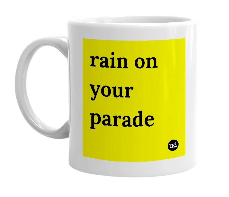 White mug with 'rain on your parade' in bold black letters
