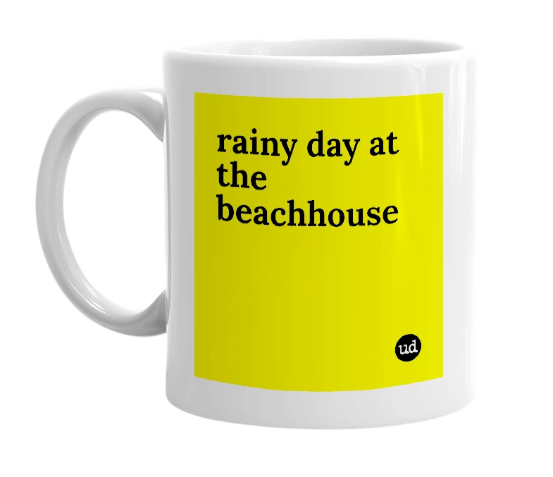 White mug with 'rainy day at the beachhouse' in bold black letters