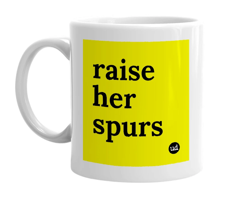 White mug with 'raise her spurs' in bold black letters