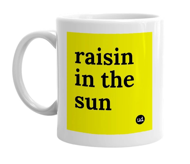 White mug with 'raisin in the sun' in bold black letters