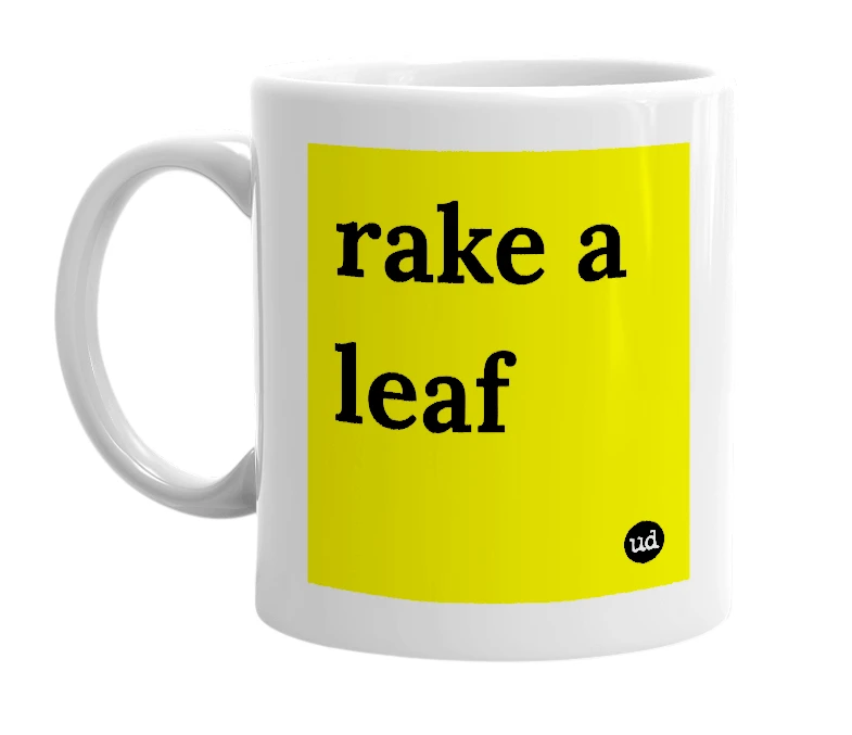 White mug with 'rake a leaf' in bold black letters