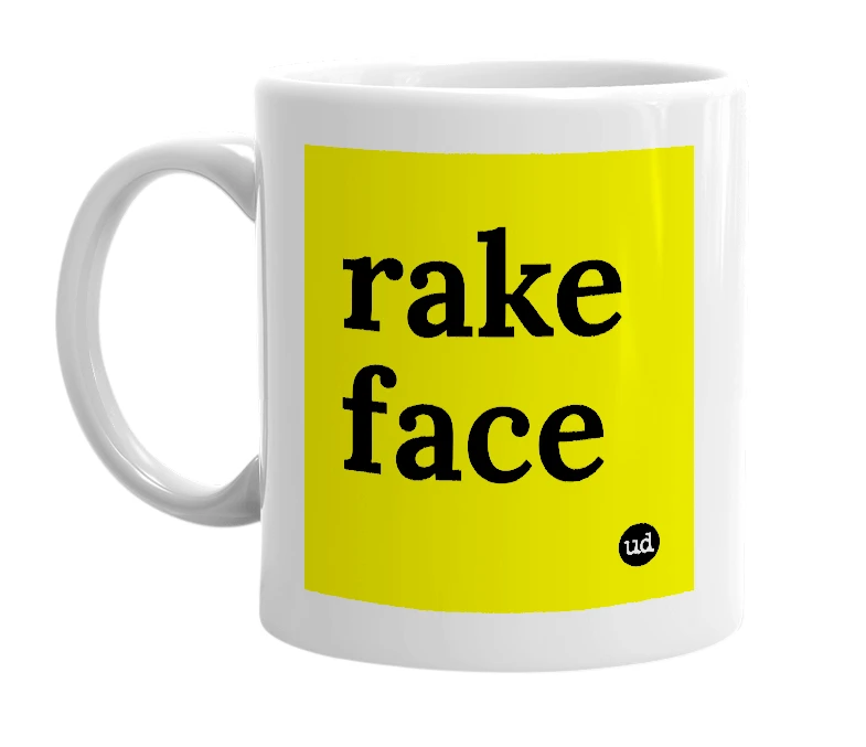 White mug with 'rake face' in bold black letters