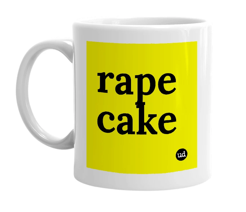 White mug with 'rape cake' in bold black letters