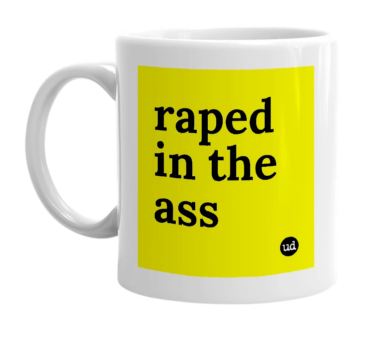 White mug with 'raped in the ass' in bold black letters