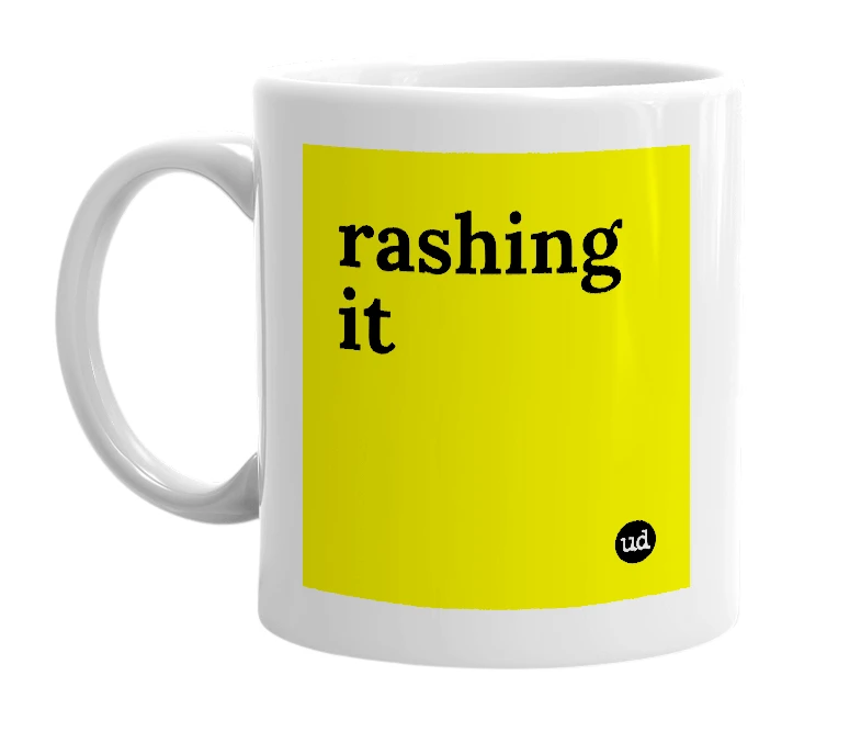 White mug with 'rashing it' in bold black letters