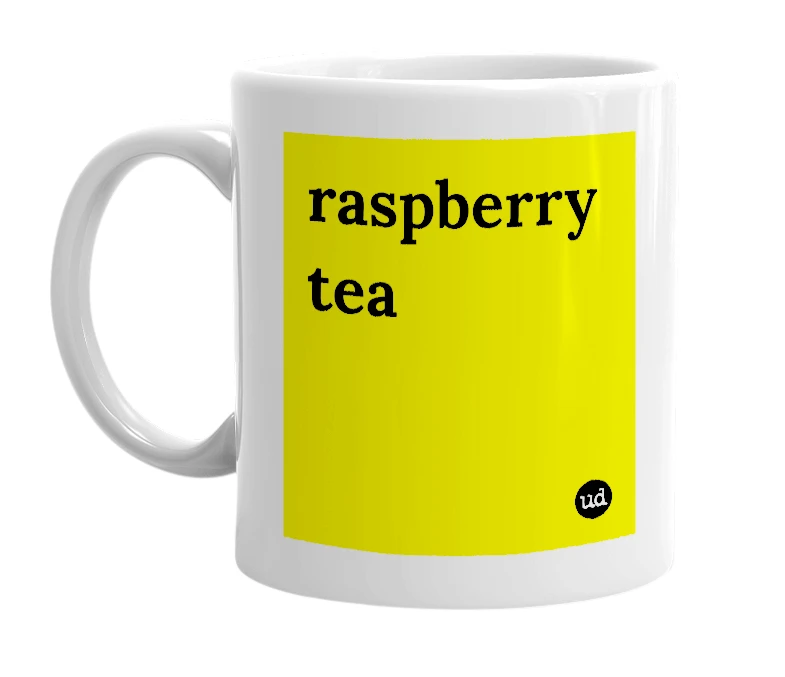 White mug with 'raspberry tea' in bold black letters