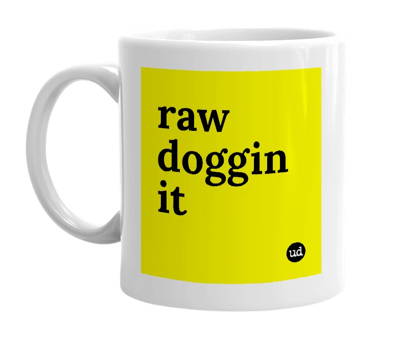 White mug with 'raw doggin it' in bold black letters