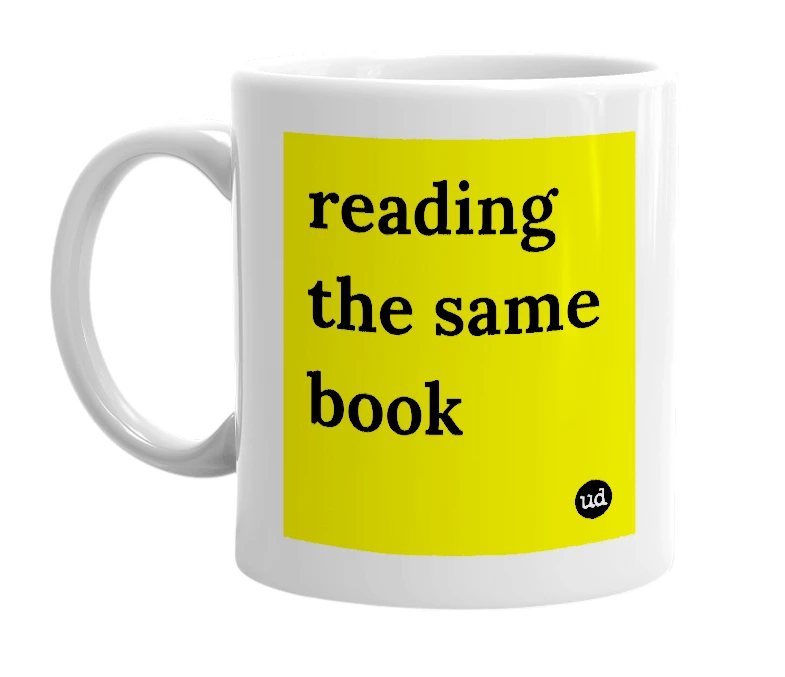 White mug with 'reading the same book' in bold black letters