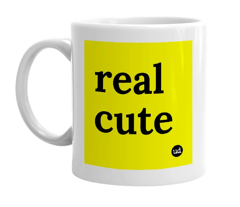 White mug with 'real cute' in bold black letters