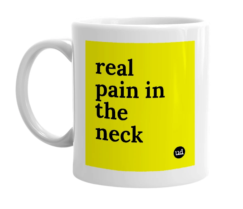 White mug with 'real pain in the neck' in bold black letters