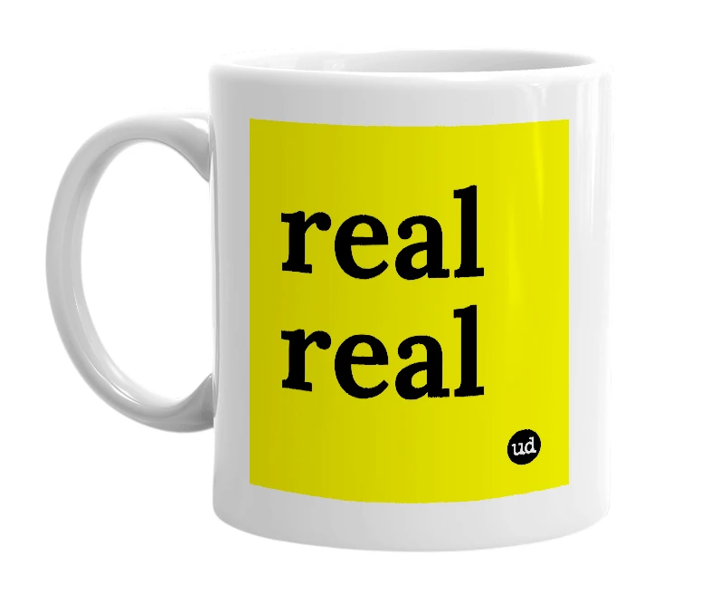 White mug with 'real real' in bold black letters