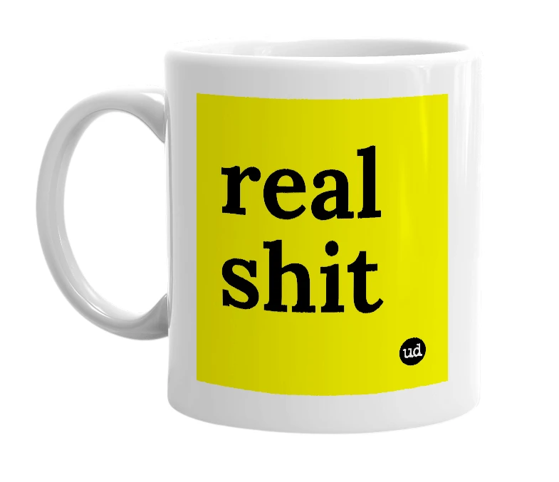 White mug with 'real shit' in bold black letters