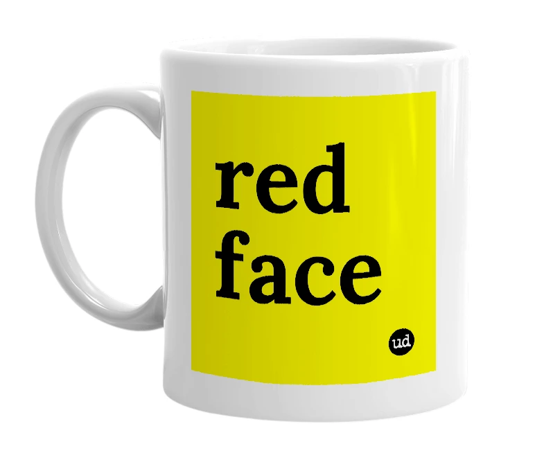 White mug with 'red face' in bold black letters