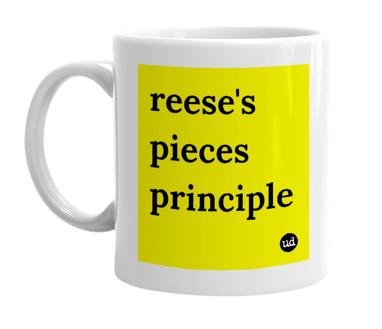 White mug with 'reese's pieces principle' in bold black letters