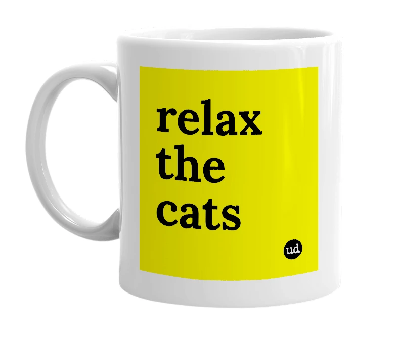 White mug with 'relax the cats' in bold black letters