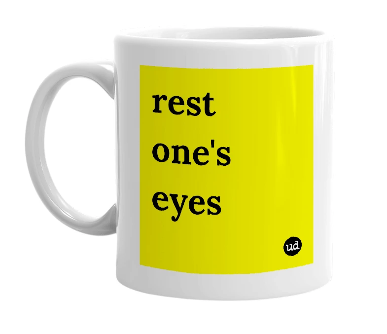 White mug with 'rest one's eyes' in bold black letters