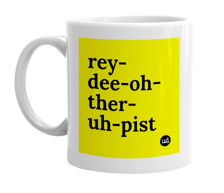 White mug with 'rey-dee-oh-ther-uh-pist' in bold black letters