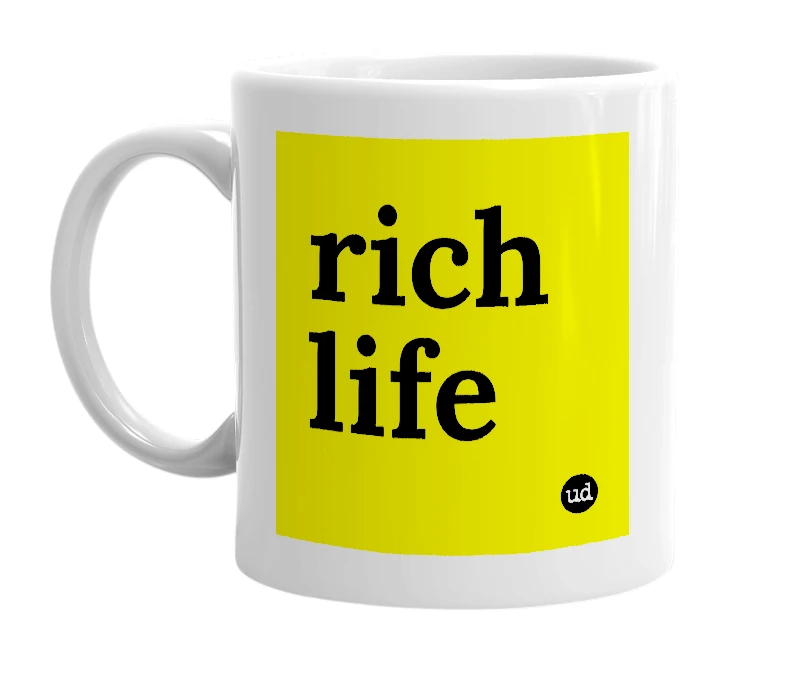 White mug with 'rich life' in bold black letters